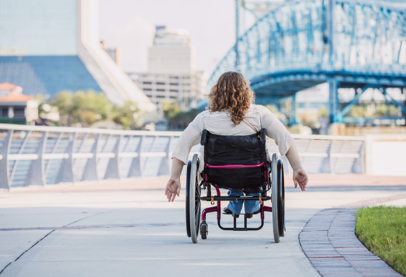 Clothing for cerebral palsy: woman in wheelchair in the city