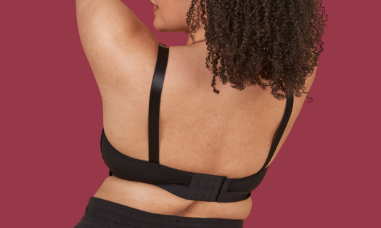 View of a woman's back showcasing the back of the adaptive velcro bra